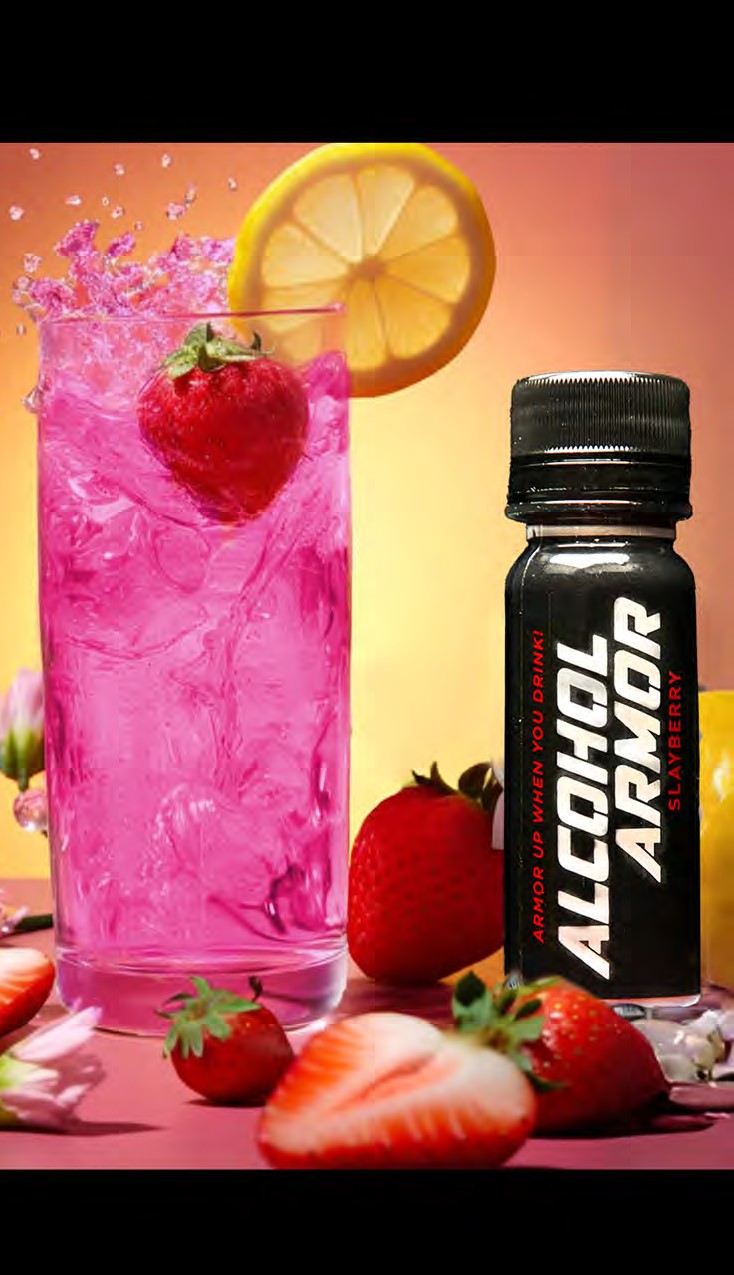 Pink cocktail beside a Slayberry bottle with strawberries