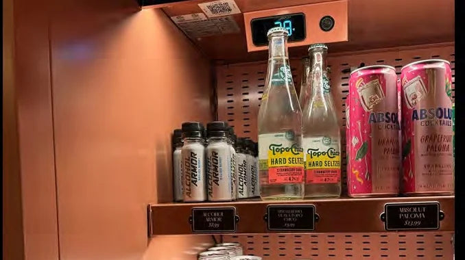 Alcohol Armor stocked on a hotel minibar shelf with its price plaque