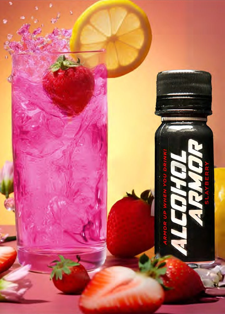 Pink cocktail beside a Slayberry bottle with strawberries