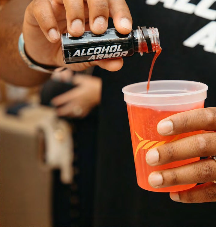 Pouring the shot into a mixed drink